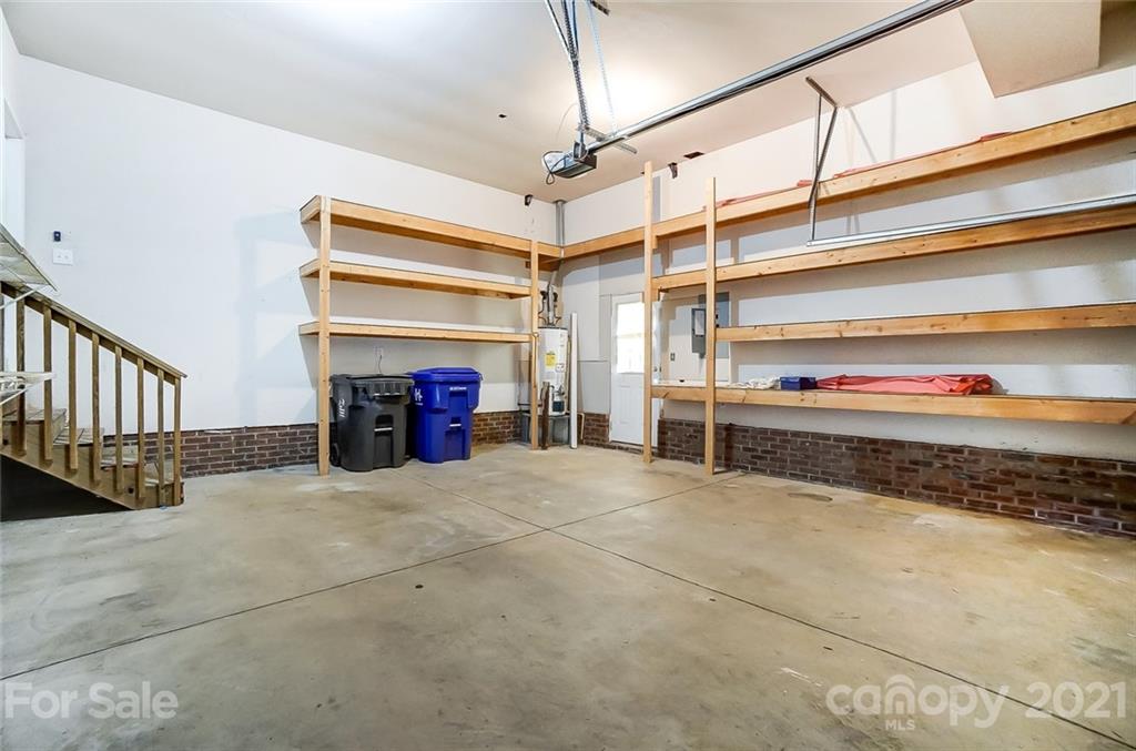 15922 Hollingbourne Road Huntersville, NC 28078 - Photo 44 of 48 a view of empty room with a fireplace and a window