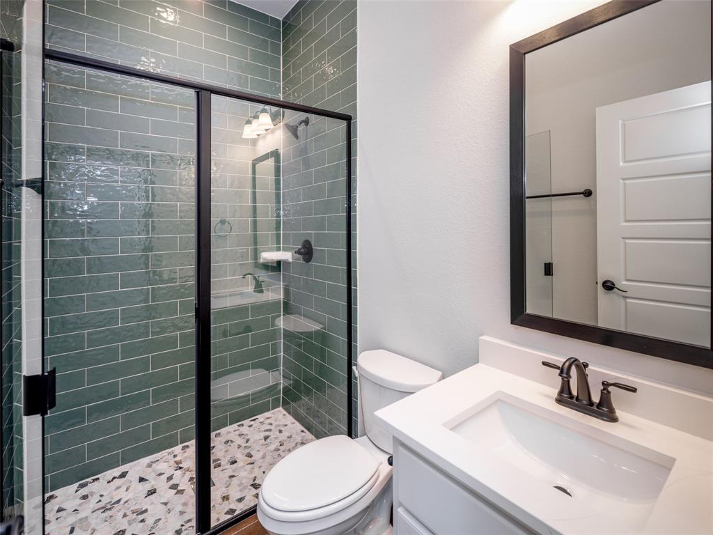 2108 Charters Circle Nevada, TX 75173 - Photo 21 of 37 Bathroom featuring vanity and a stall shower