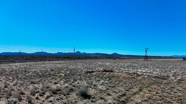 a view of an ocean beach and a yard