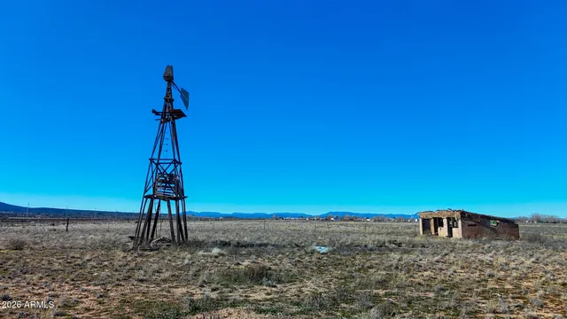 a picture of a room with table and chairs