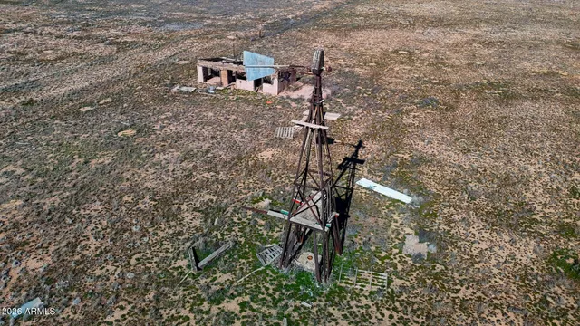 a view of a large building with a mountain in the background