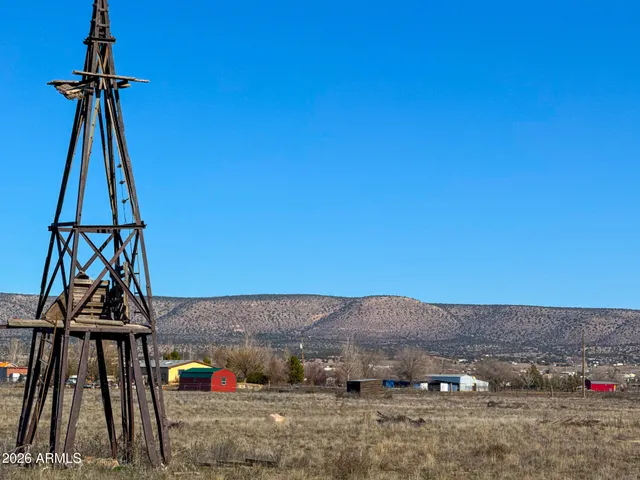 a view of a big yard with an ocean