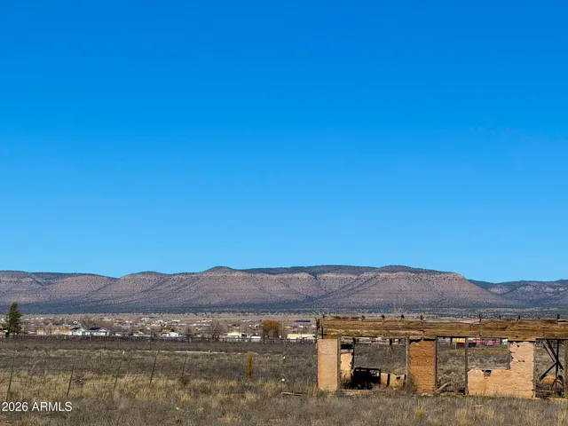 a view of a town with mountains in the background