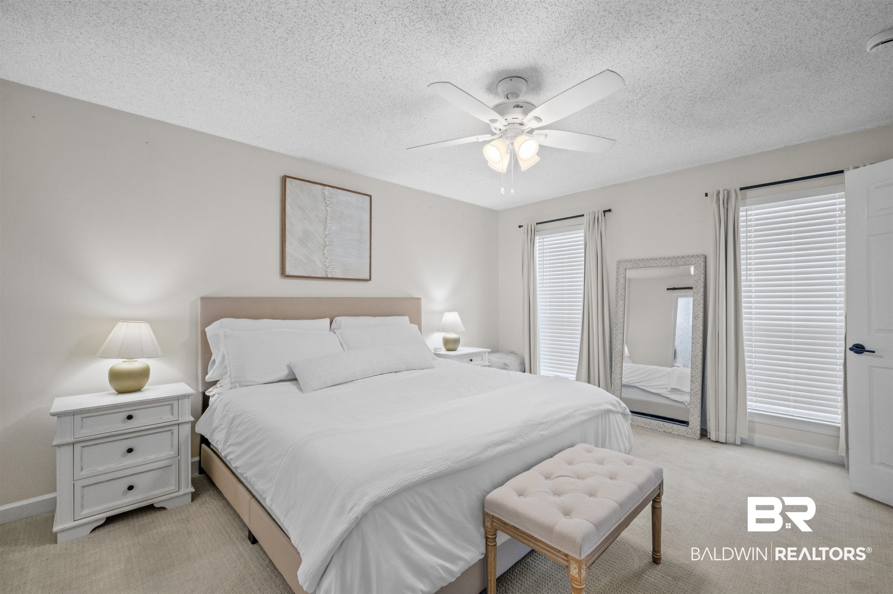 1066 Linlen Avenue Mobile, AL 36609 - Photo 12 of 22 Bedroom with baseboards, a textured ceiling, a ceiling fan, and light colored carpet