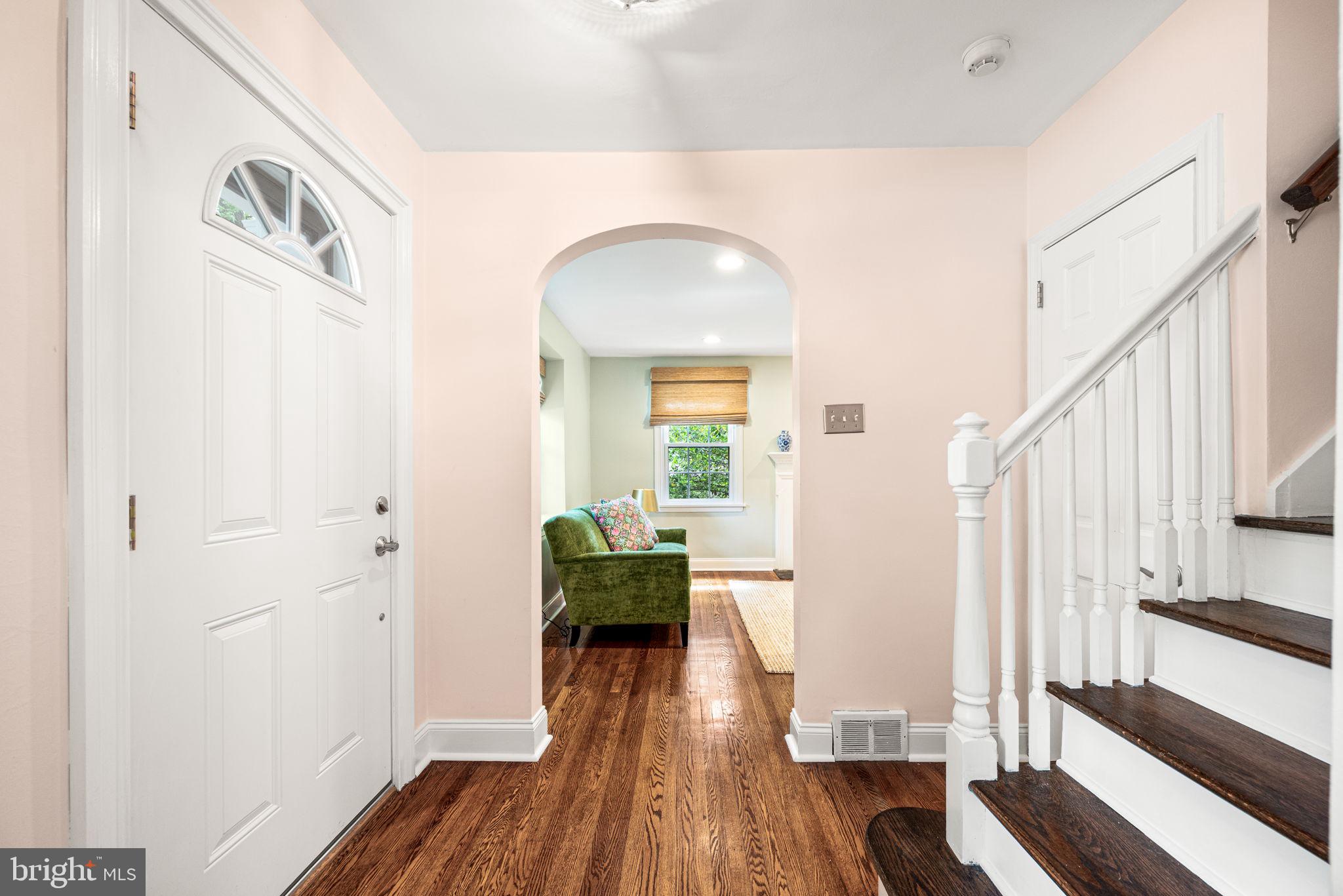 121 Upper Gulph Road Wayne, PA 19087 - Photo 4 of 42 Foyer with arched doorway and hardwood floor