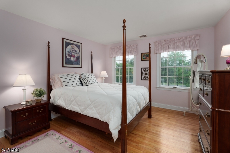 110 Orchard Road Skillman, NJ 08558 - Photo 26 of 43 a bedroom with double bed and a flat tv screen