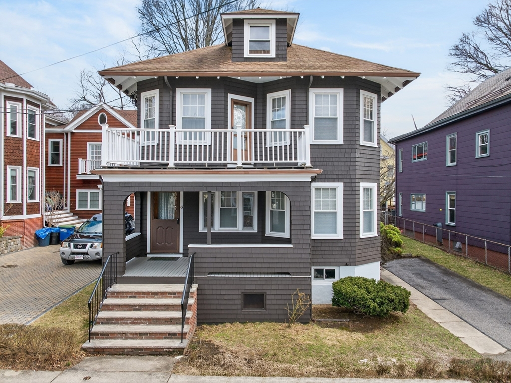 67 Irving Street Somerville, MA 02144 - Photo 1 of 40 a front view of a house with a yard