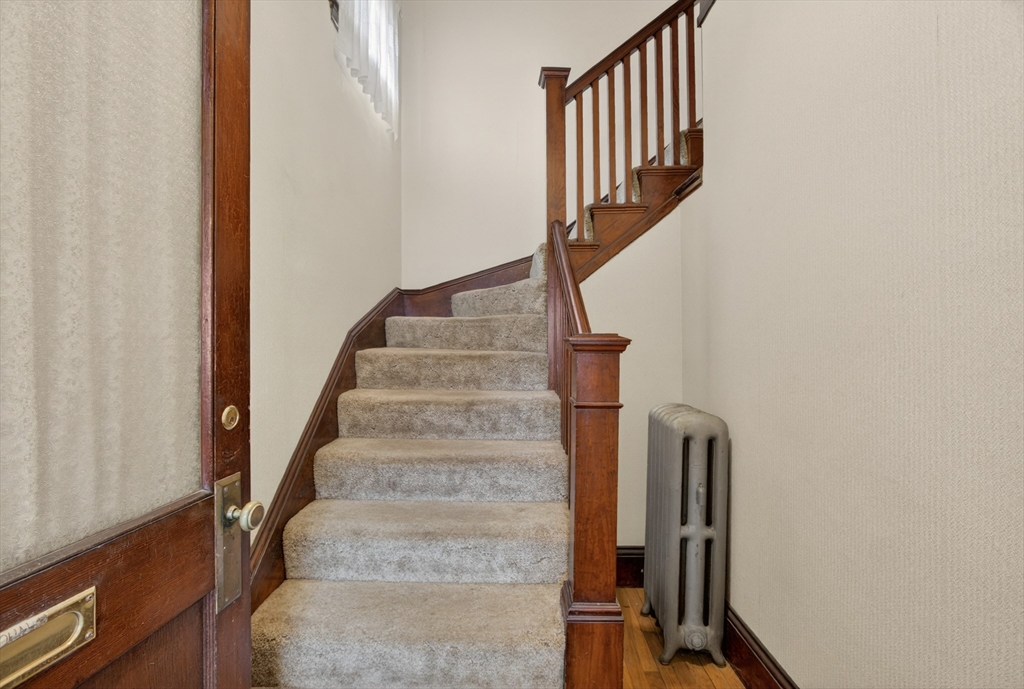 67 Irving Street Somerville, MA 02144 - Photo 18 of 40 a view of entryway with wooden floor