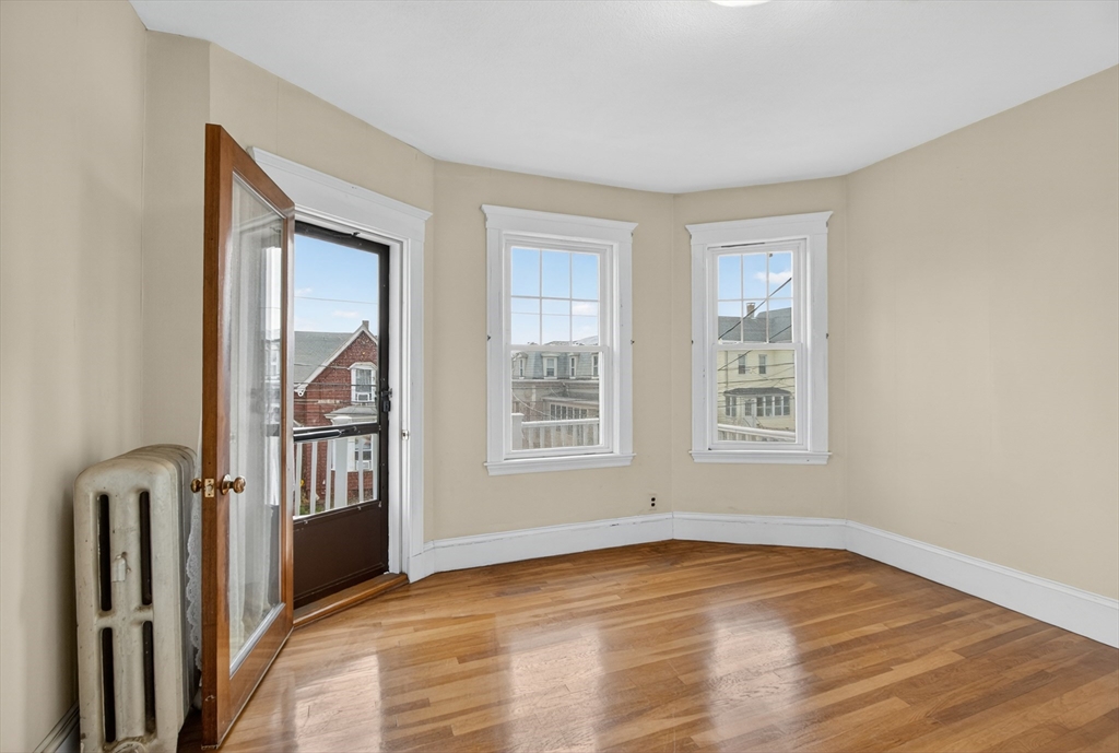 67 Irving Street Somerville, MA 02144 - Photo 20 of 40 a view of an empty room with a window