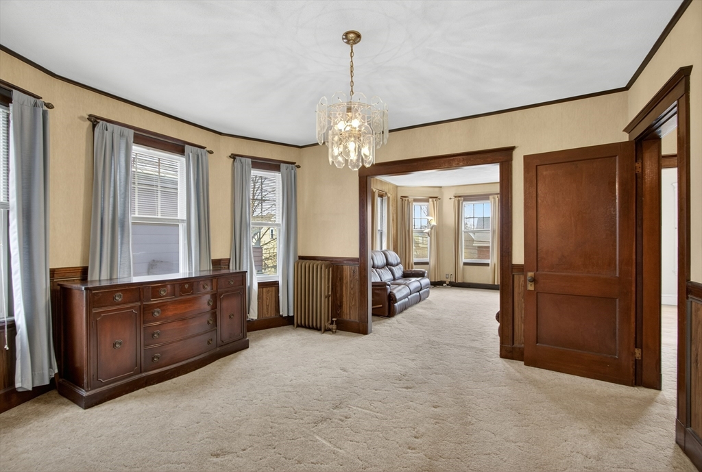 67 Irving Street Somerville, MA 02144 - Photo 23 of 40 a living room with furniture and large windows