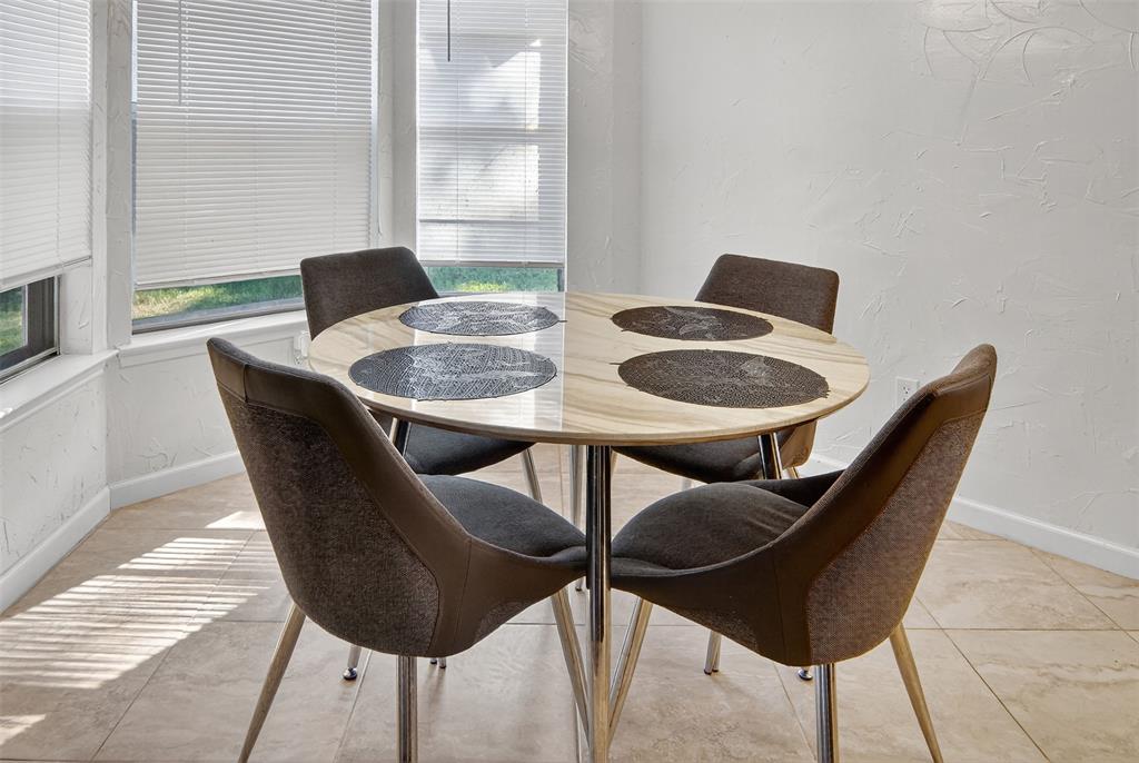 6004 Old Mill Court Watauga, TX 76148 - Photo 12 of 26 a dining room with furniture and a window