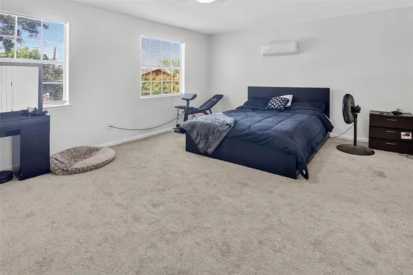 a bedroom with a bed and a cabinets