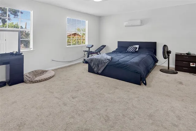 a bedroom with a bed and a cabinets