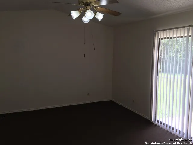 a view of a livingroom with a fan