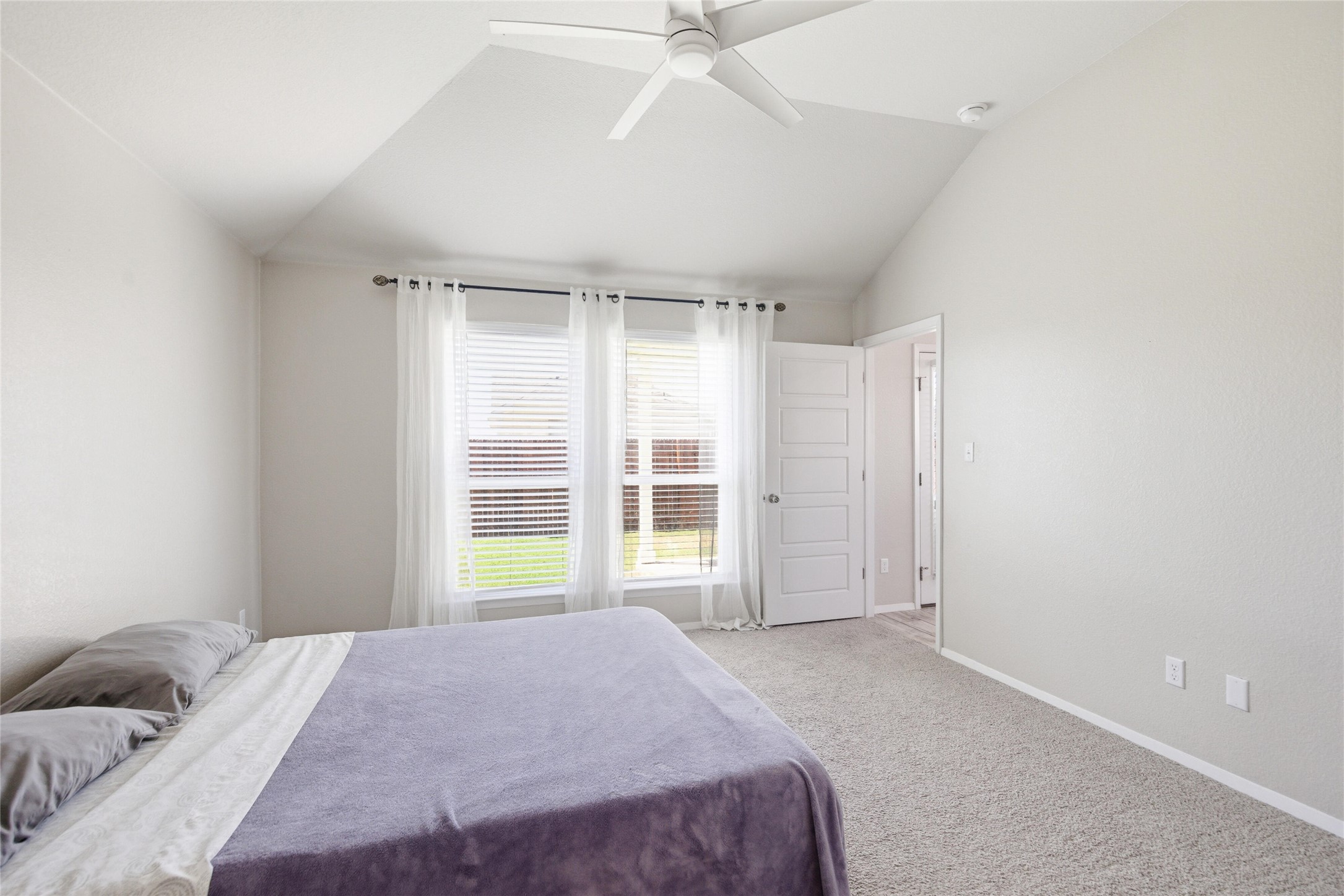 269 Gaida Loop Georgetown, TX 78628 - Photo 10 of 20 Bedroom with vaulted ceiling, carpet, and ceiling fan
