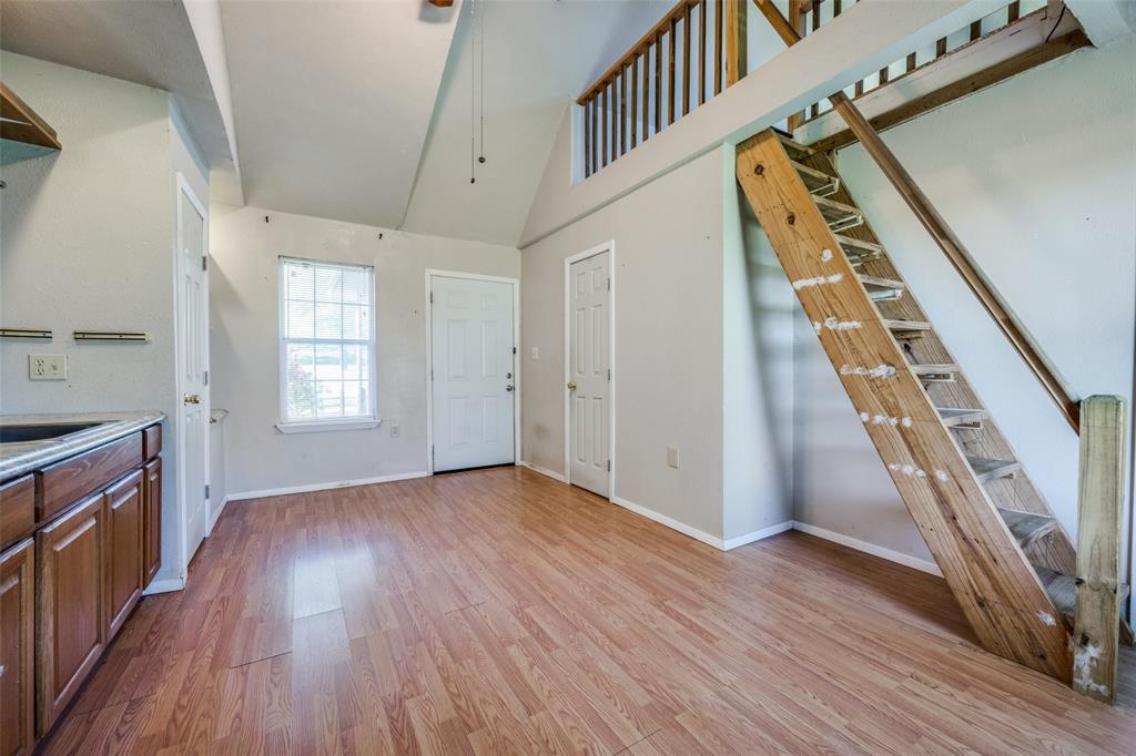 970 McReynolds Road Sanger, TX 76266 - Photo 19 of 25 The versatile living area in the cottage has a sink & counter space for coffee and a microwave. The stairs lead to a cozy loft.