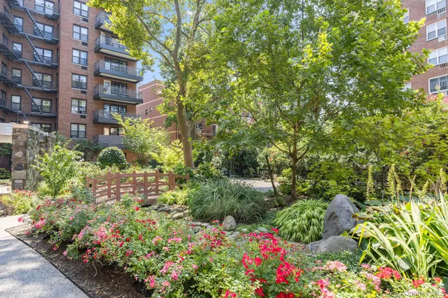 a view of a garden with a building