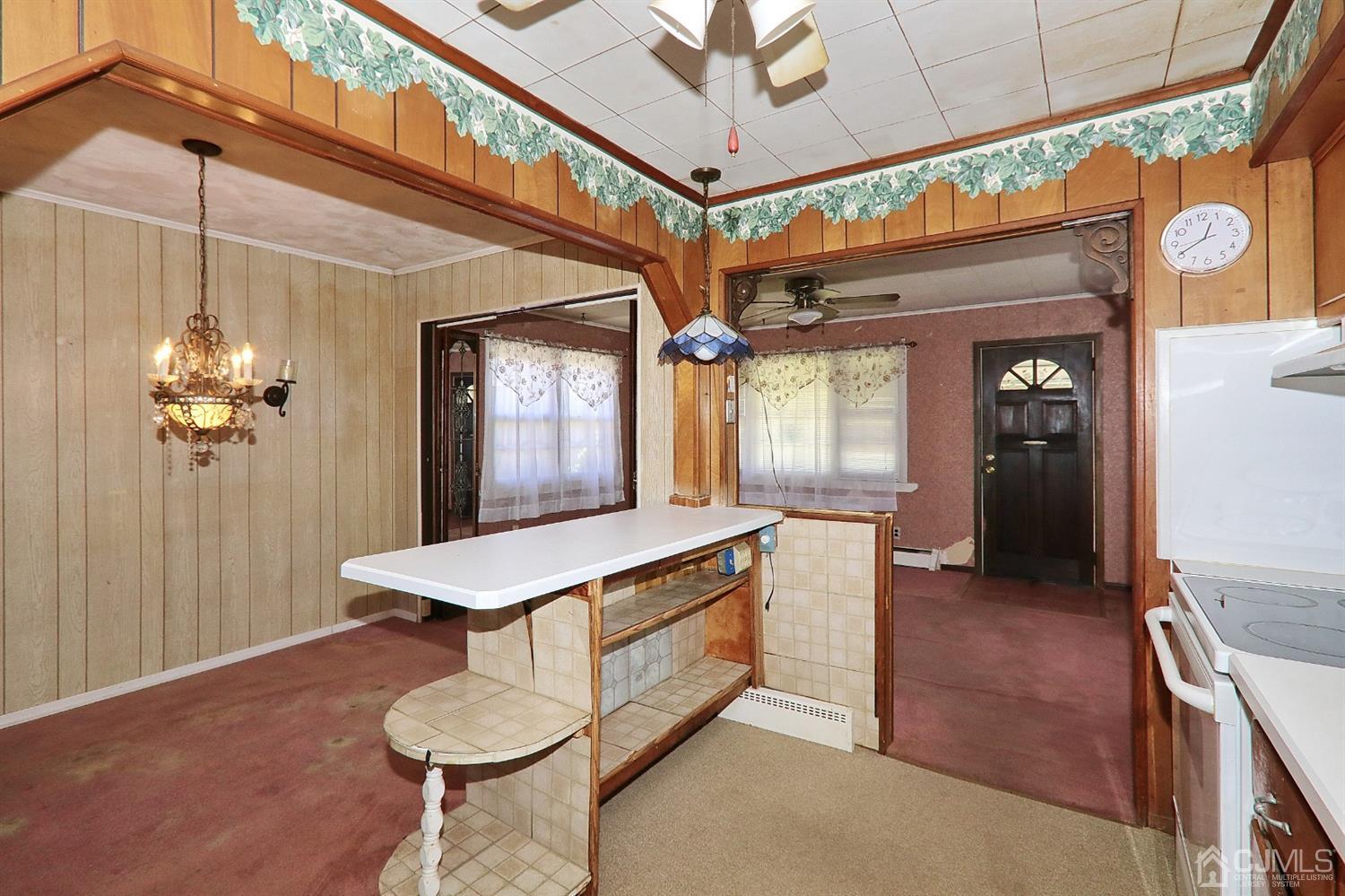 170 East Hill Road Colonia, NJ 07067 - Photo 11 of 25 a kitchen with a table and chairs