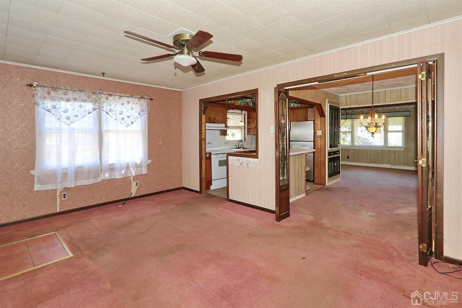 170 East Hill Road Colonia, NJ 07067 - Photo 14 of 25 a view of an empty room with a fireplace and a window