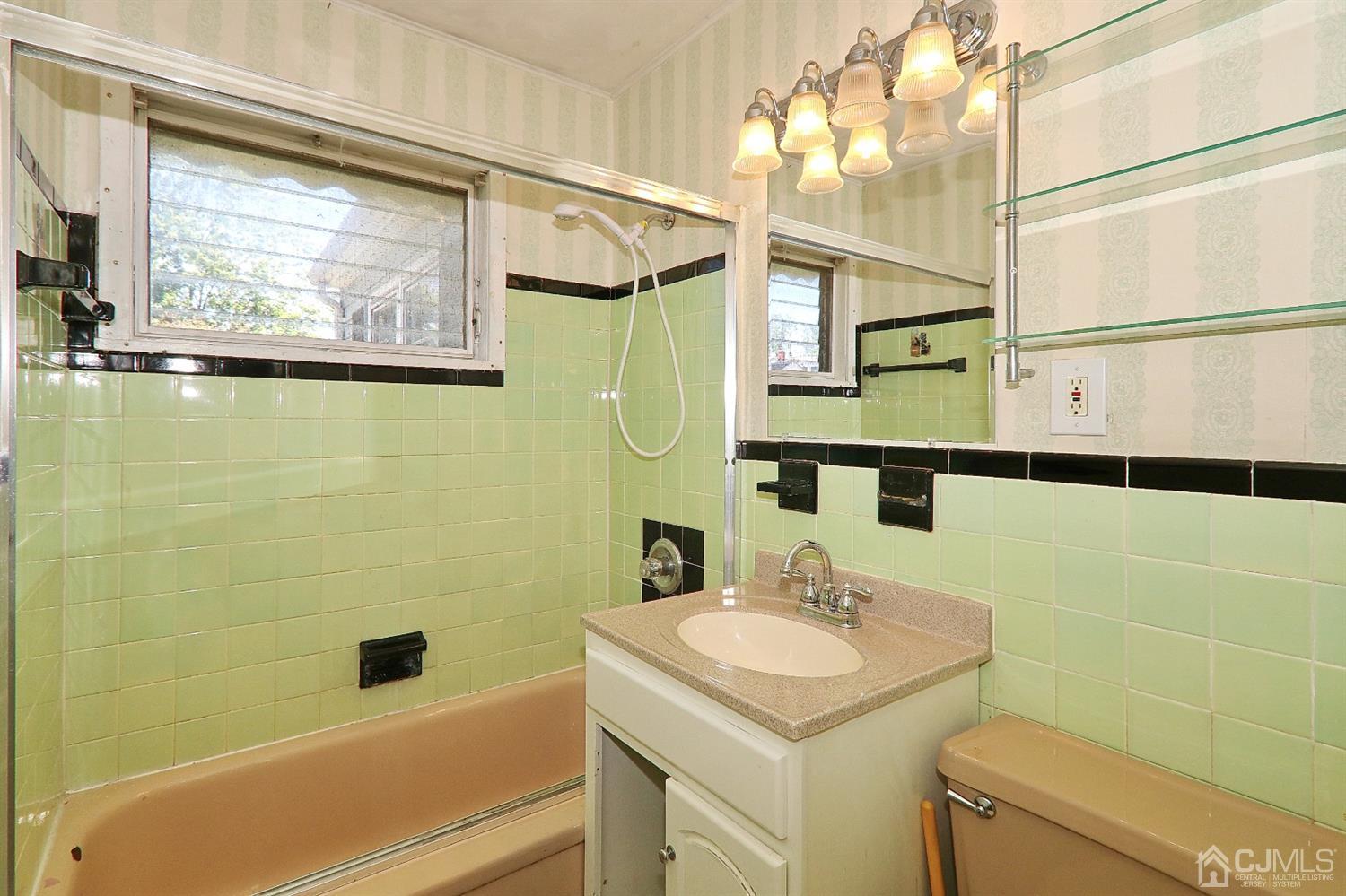 170 East Hill Road Colonia, NJ 07067 - Photo 16 of 25 a bathroom with a sink and a mirror