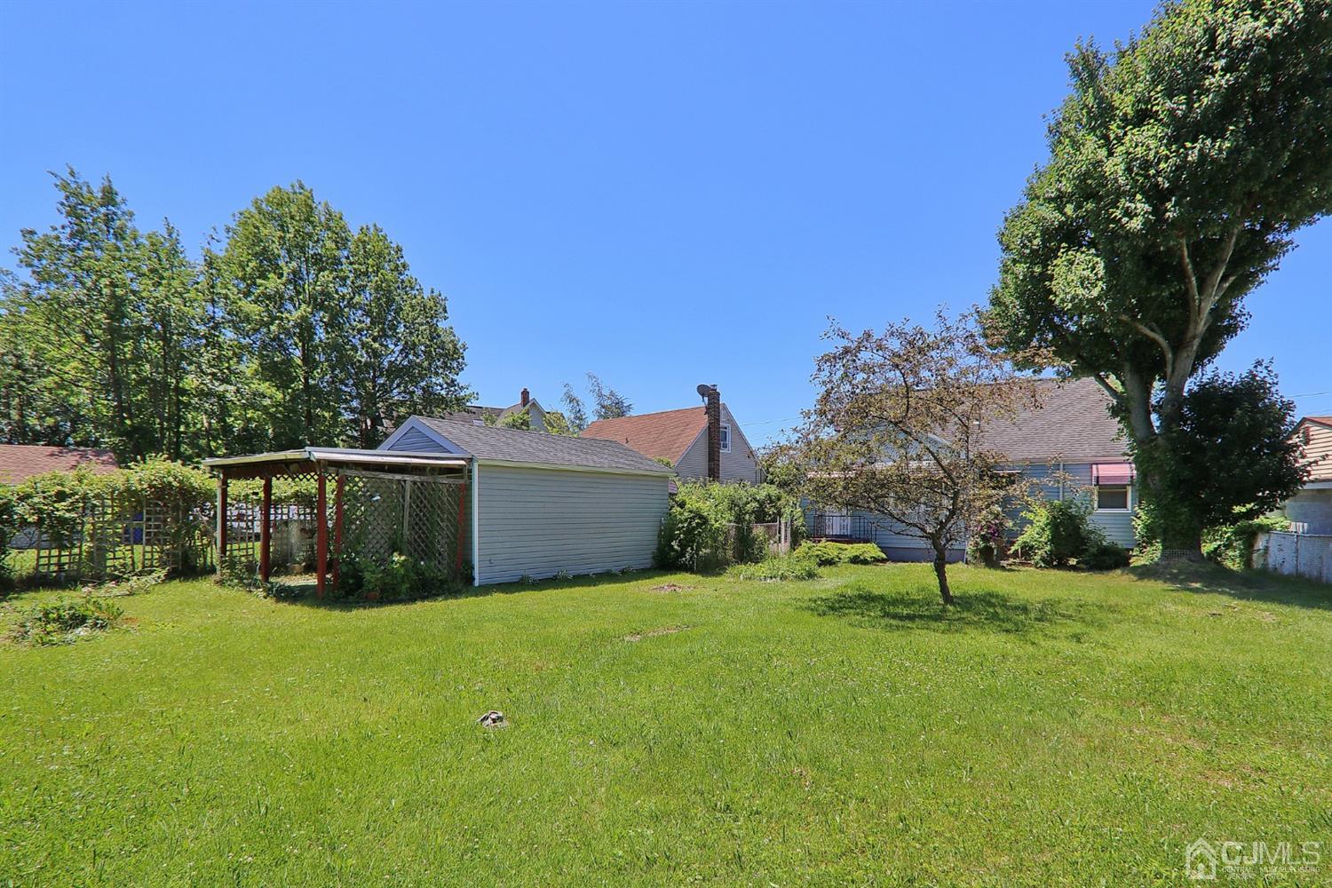 170 East Hill Road Colonia, NJ 07067 - Photo 24 of 25 a view of a house with a big yard