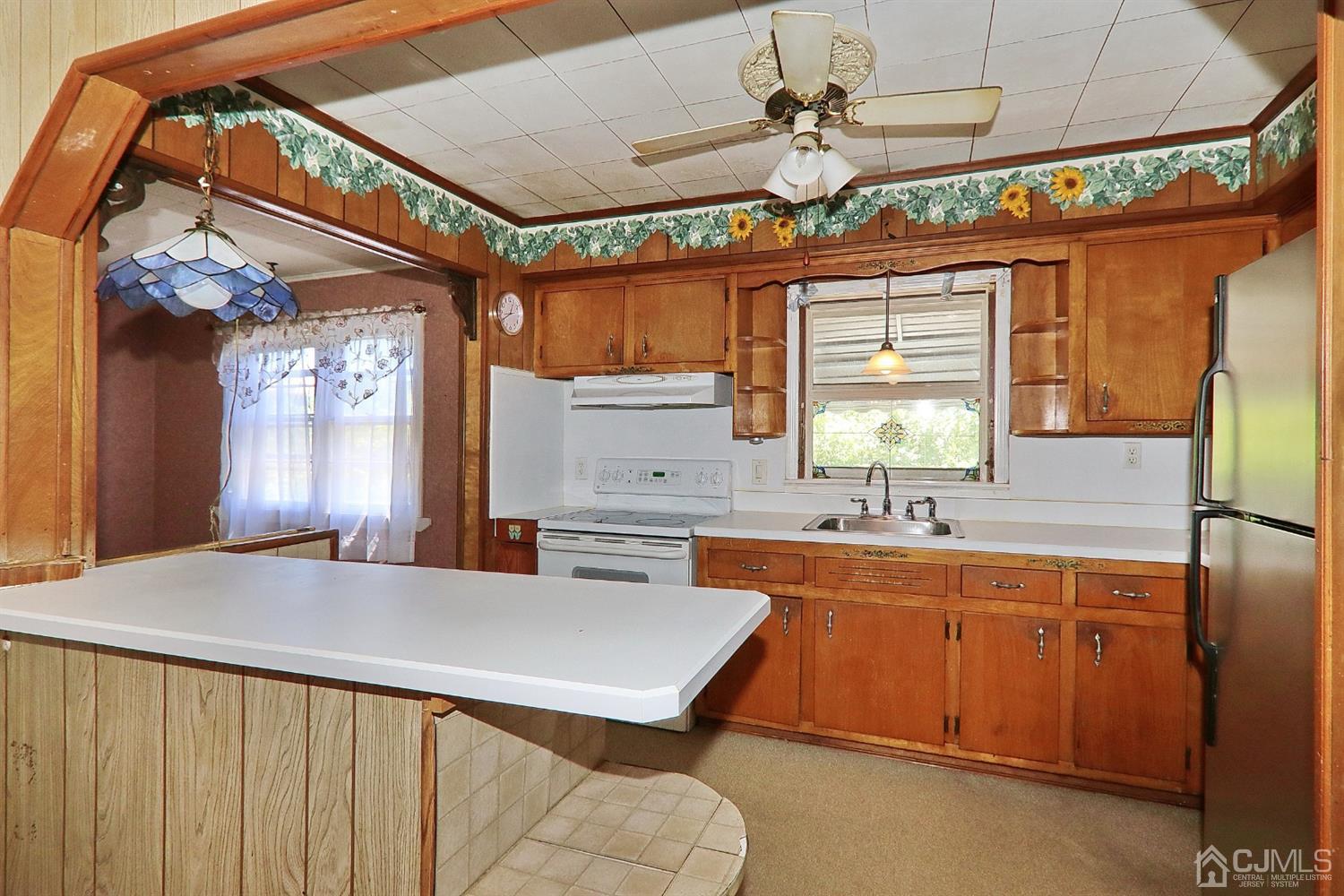 170 East Hill Road Colonia, NJ 07067 - Photo 10 of 25 a kitchen with a sink a counter space appliances and cabinets