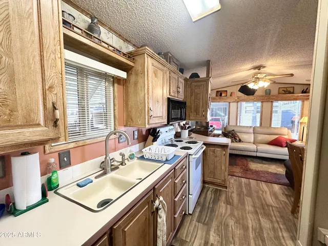 a bathroom with a shower a sink and a mirror