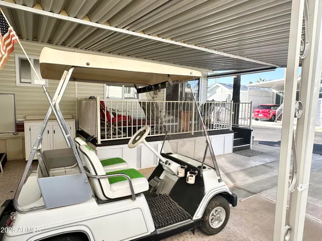 a view of a room with wooden floor and windows