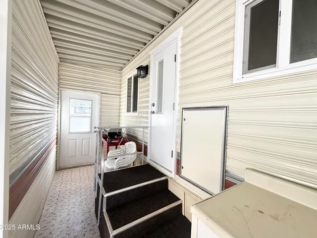 a front view of a house with outdoor seating
