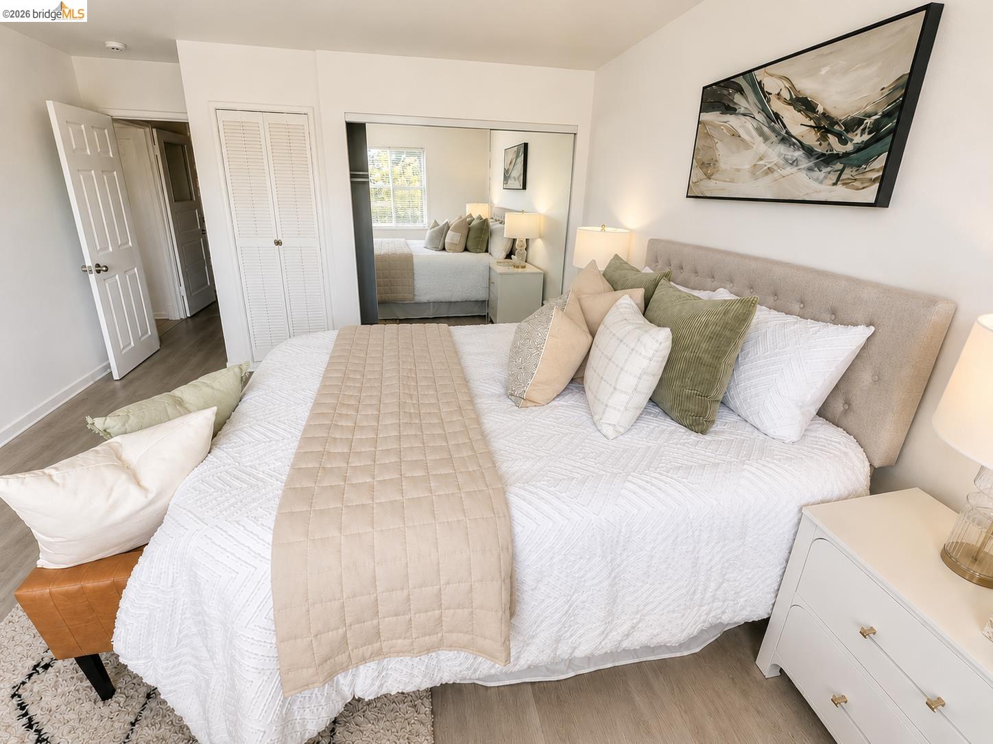 810 Pierce Street Albany, CA 94706 - Photo 3 of 25 Bedroom featuring light wood-finish flooring, white walls, and a tufted fabric headboard