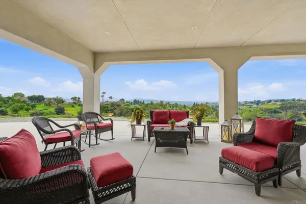a view of a city from a dining room with furniture