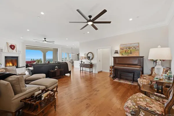 a kitchen with white cabinets and a refrigerator
