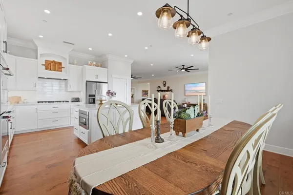 a kitchen with cabinets and stainless steel appliances