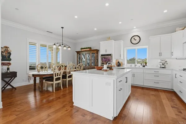 a bathroom with a sink mirror and toilet