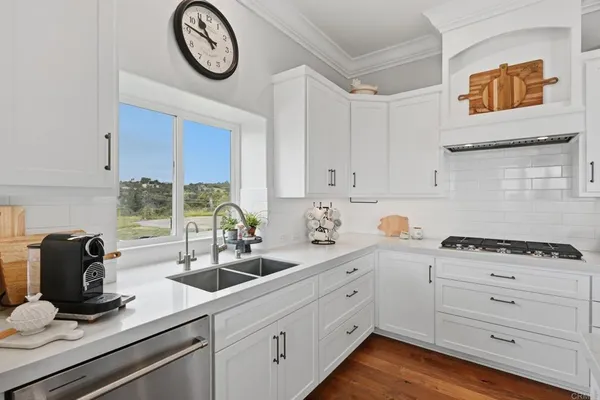 a spacious bedroom with a bed and a ceiling fan