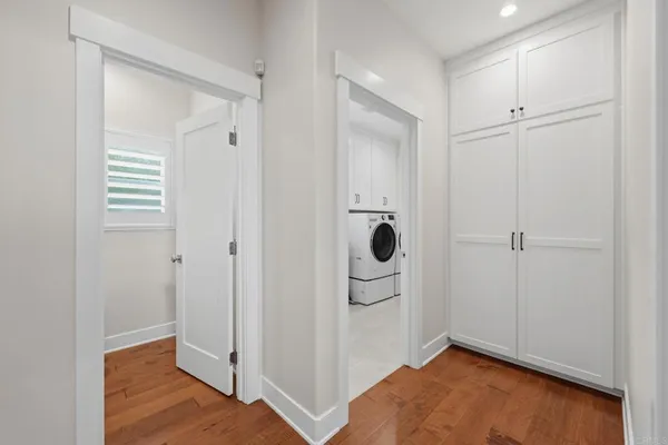 a bathroom with a granite countertop sink a mirror and shower