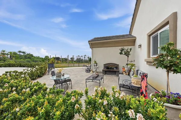 swimming pool with outdoor seating and plants