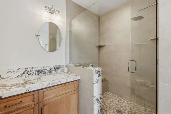 a bedroom with a bed and a lamp