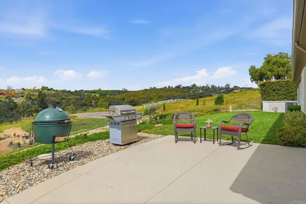a view of a swimming pool with a yard
