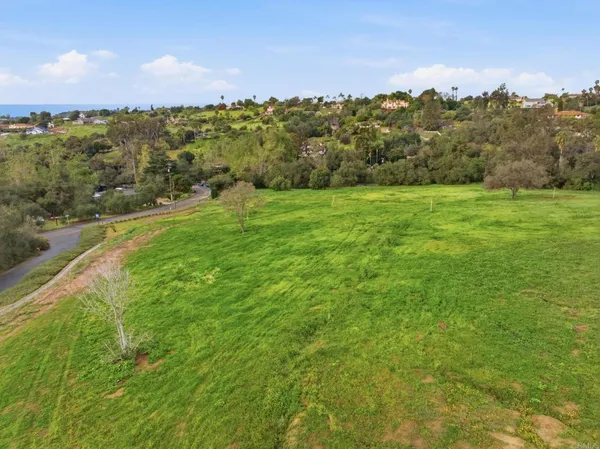 a view of a city with mountains in the background