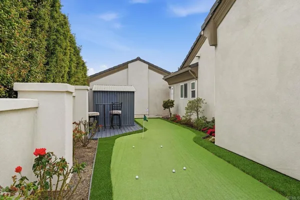 a living room with furniture ceiling fan and a fireplace