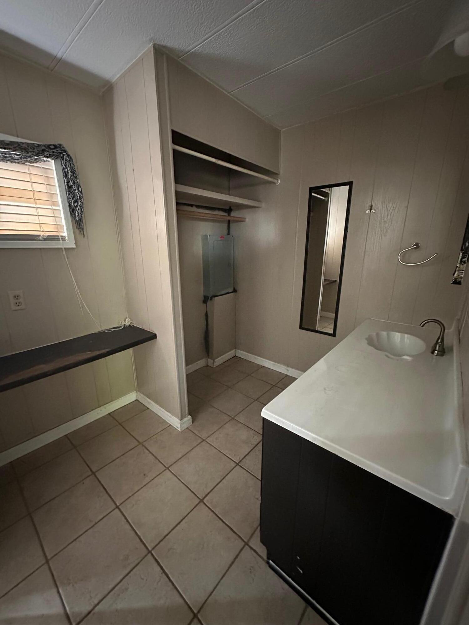 421 Stevens Road, Unit 52 Eagle Point, OR 97524 - Photo 16 of 18 a bathroom with a sink and a mirror