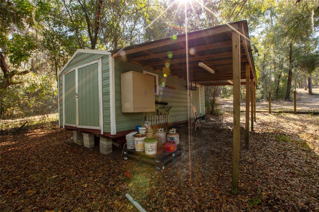 730 Highway 26 Melrose, FL 32666 - Photo 11 of 80 a backyard of a house with table and chairs