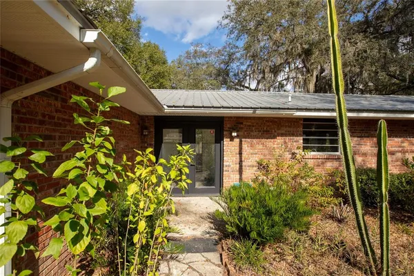 a kitchen with stainless steel appliances granite countertop a refrigerator and a stove