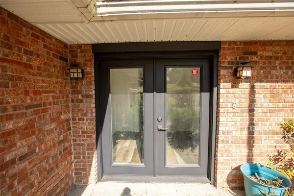a large kitchen with stainless steel appliances lots of counter space and a sink