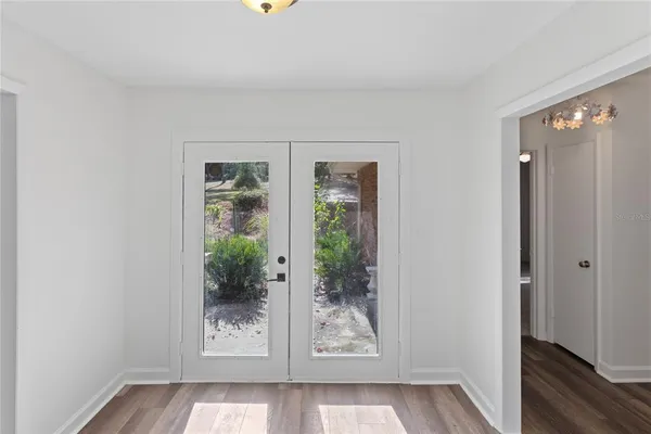 a open kitchen with stainless steel appliances granite countertop a refrigerator and a sink