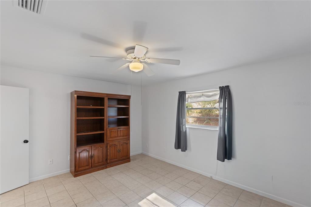 730 Highway 26 Melrose, FL 32666 - Photo 42 of 80 an empty room with windows and cabinet