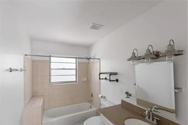 a bathroom with a shower and toilet