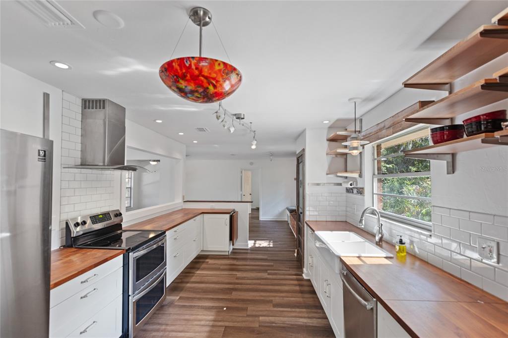 730 Highway 26 Melrose, FL 32666 - Photo 54 of 80 a large kitchen with stainless steel appliances lots of counter space and a sink