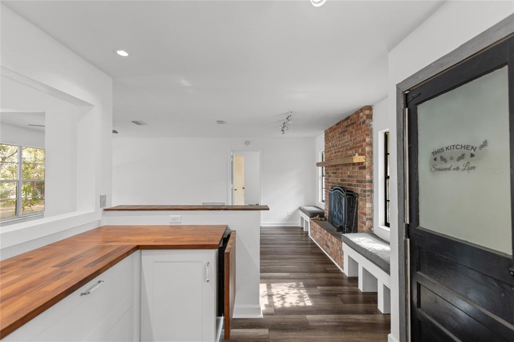 730 Highway 26 Melrose, FL 32666 - Photo 56 of 80 a view of a kitchen with furniture and a fireplace